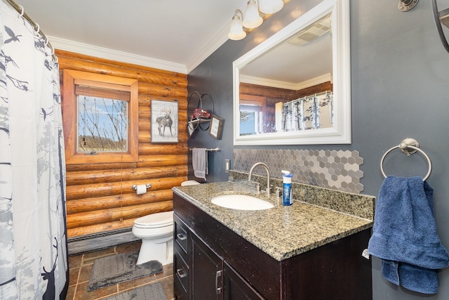 bathroom featuring visible vents, toilet, vanity, ornamental molding, and log walls