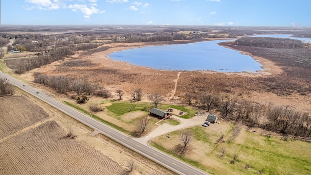 drone / aerial view with a water view and a rural view