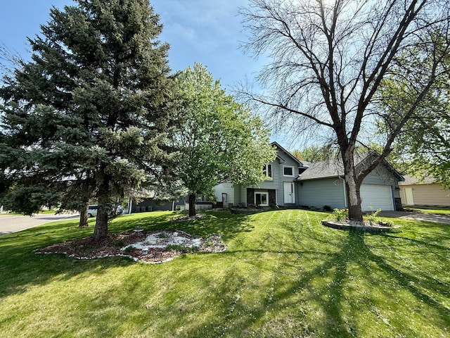 14303 Utica Ave, Savage, MN 55378 - view of front of property with a front yard, driveway, and a garage