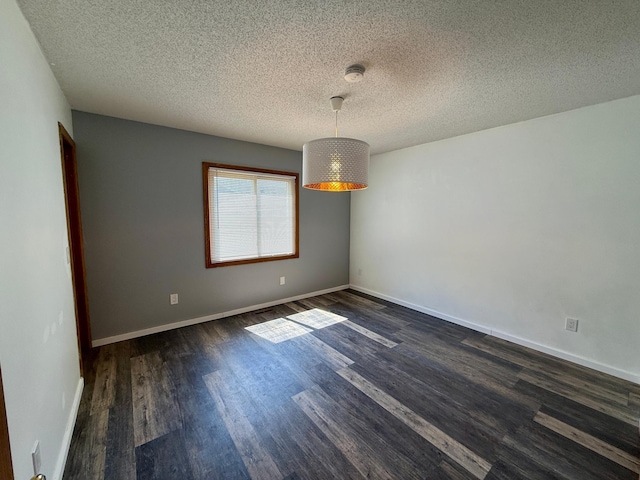 14303 Utica Ave, Savage, MN 55378 - unfurnished room with a textured ceiling, dark wood-type flooring, baseboards, and a smoke detector