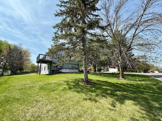 14303 Utica Ave, Savage, MN 55378 - view of green lawn featuring a wooden deck