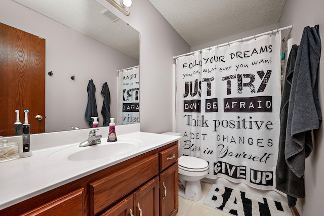 bathroom featuring vanity, tile patterned floors, a textured ceiling, toilet, and visible vents