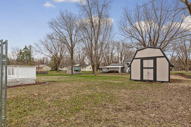 view of yard with an outdoor structure and a storage unit