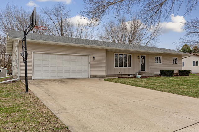 ranch-style house featuring an attached garage, a front lawn, and driveway
