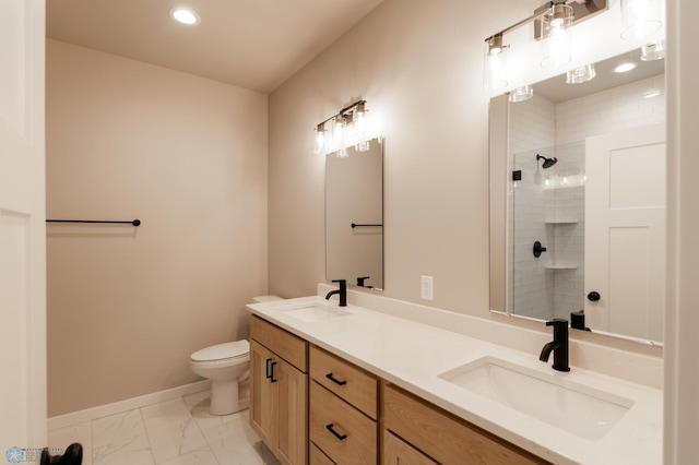 full bath featuring a tile shower, marble finish floor, a sink, and toilet