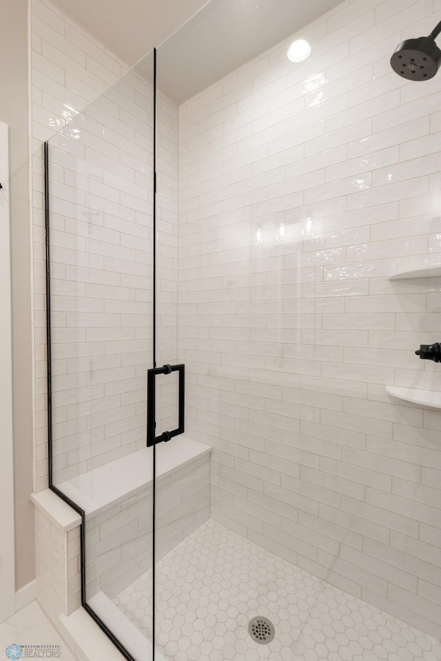 bathroom featuring a stall shower