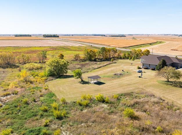 birds eye view of property featuring a rural view