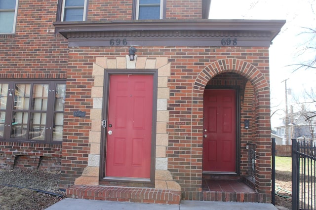 696 Hawthorne Ave E, Saint Paul, MN 55106 - property entrance with brick siding and fence