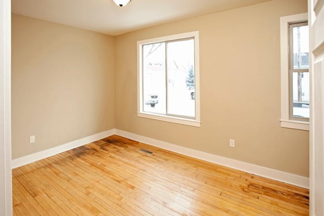 697 Cook Ave E, Saint Paul, MN 55106 - unfurnished room with light wood-style flooring and baseboards