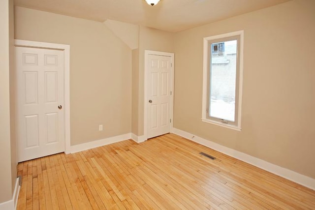 697 Cook Ave E, Saint Paul, MN 55106 - spare room featuring light wood-type flooring and baseboards