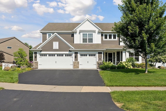 20413 Everton Trl N, Forest Lake, MN 55025 - craftsman inspired home featuring aphalt driveway, a garage, stone siding, a front lawn, and a shingled roof
