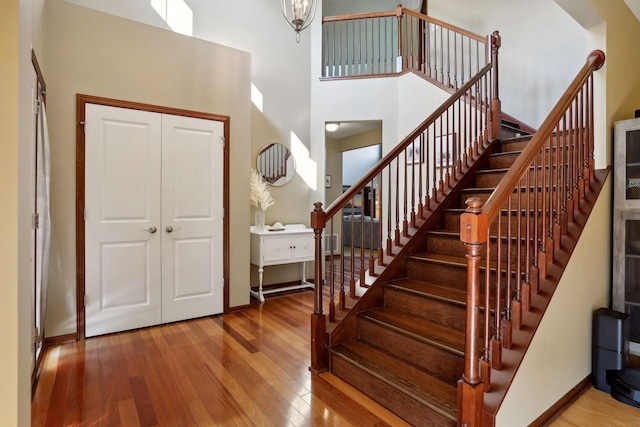 20413 Everton Trl N, Forest Lake, MN 55025 - foyer featuring baseboards, stairs, a high ceiling, and hardwood / wood-style floors