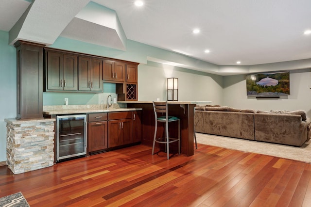 20413 Everton Trl N, Forest Lake, MN 55025 - kitchen with open floor plan, light countertops, hardwood / wood-style floors, beverage cooler, and a sink