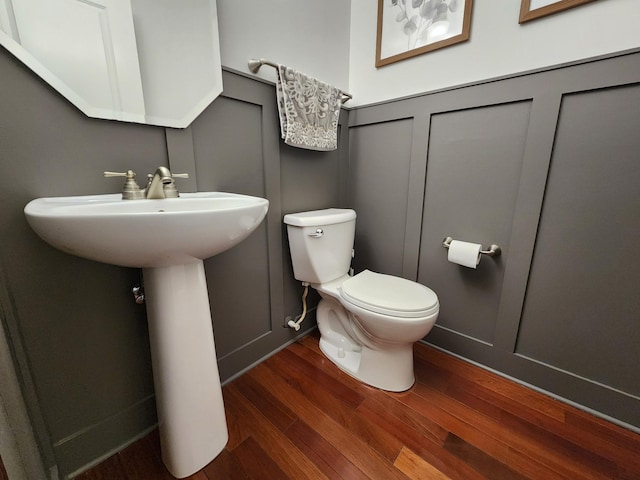 20413 Everton Trl N, Forest Lake, MN 55025 - bathroom featuring a decorative wall, toilet, and wood finished floors