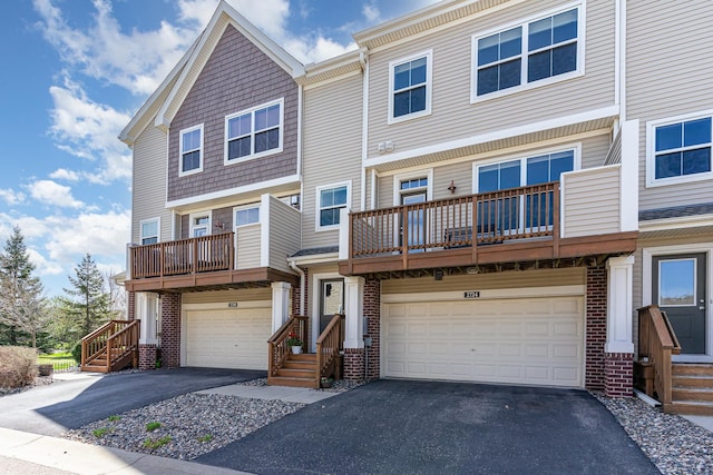 2724 135th St W, Rosemount, MN 55068 - view of property with an attached garage, aphalt driveway, and a balcony