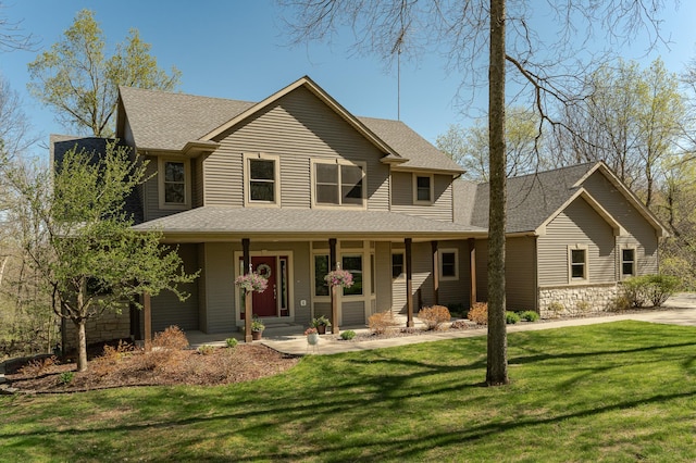 1125 Riverwood Dr SW, Oronoco, MN 55960 - view of front of property featuring covered porch, a shingled roof, and a front lawn