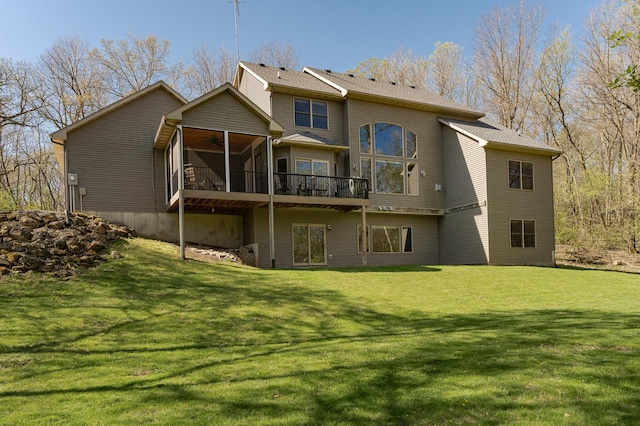 1125 Riverwood Dr SW, Oronoco, MN 55960 - rear view of house featuring a ceiling fan, a sunroom, a deck, and a lawn