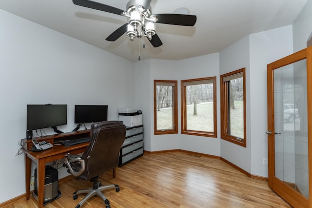 1125 Riverwood Dr SW, Oronoco, MN 55960 - office with light wood-style floors, healthy amount of natural light, baseboards, and ceiling fan