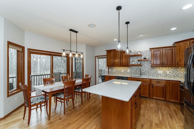 1125 Riverwood Dr SW, Oronoco, MN 55960 - kitchen with backsplash, a sink, open shelves, light wood-style flooring, and brown cabinetry