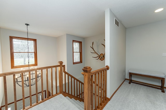 1125 Riverwood Dr SW, Oronoco, MN 55960 - stairway with carpet, plenty of natural light, baseboards, and recessed lighting