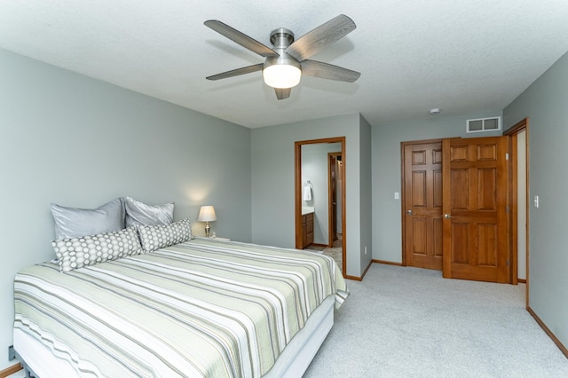 1125 Riverwood Dr SW, Oronoco, MN 55960 - bedroom featuring light carpet, baseboards, ceiling fan, and ensuite bath
