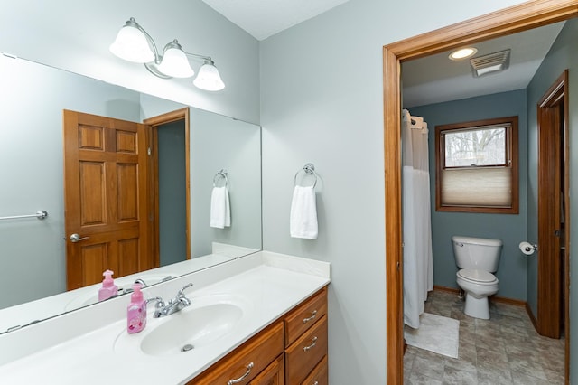 1125 Riverwood Dr SW, Oronoco, MN 55960 - bathroom with vanity, toilet, and baseboards