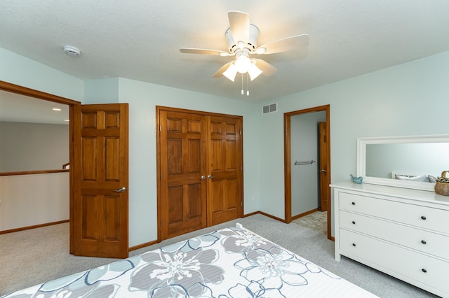1125 Riverwood Dr SW, Oronoco, MN 55960 - bedroom with a closet, light colored carpet, baseboards, and ceiling fan