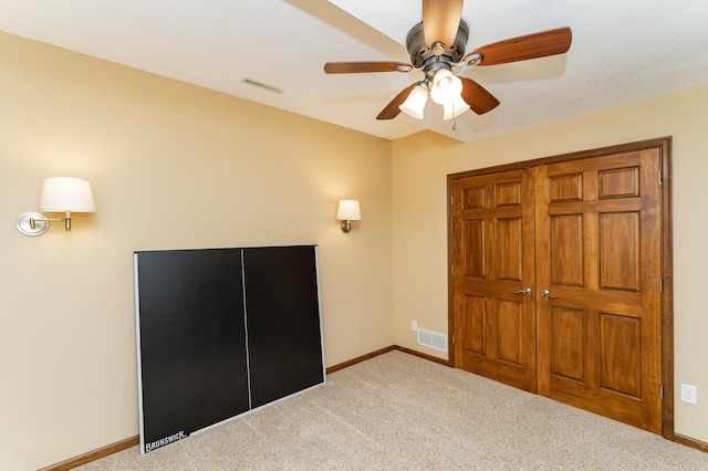 1125 Riverwood Dr SW, Oronoco, MN 55960 - unfurnished bedroom featuring carpet floors, baseboards, and a ceiling fan