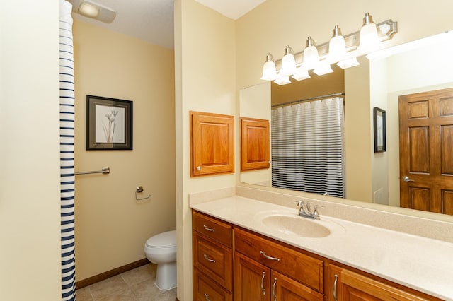 1125 Riverwood Dr SW, Oronoco, MN 55960 - bathroom with vanity, toilet, tile patterned floors, curtained shower, and baseboards