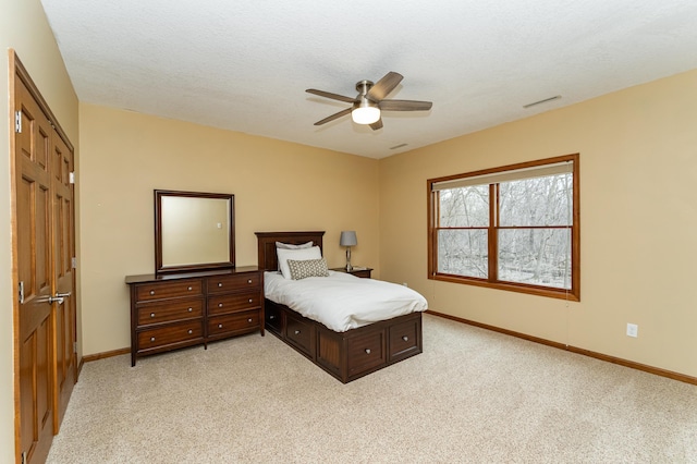 1125 Riverwood Dr SW, Oronoco, MN 55960 - bedroom featuring baseboards, light carpet, and ceiling fan