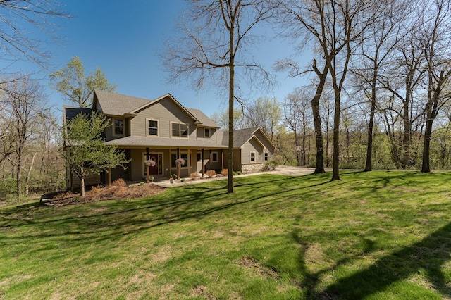 1125 Riverwood Dr SW, Oronoco, MN 55960 - view of front facade featuring a porch, a front lawn, and a shingled roof