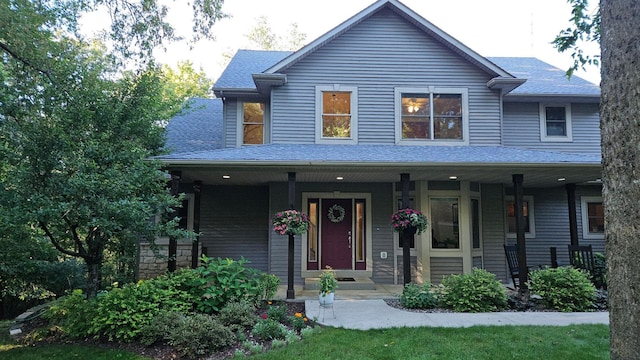 1125 Riverwood Dr SW, Oronoco, MN 55960 - view of front facade featuring covered porch and a shingled roof