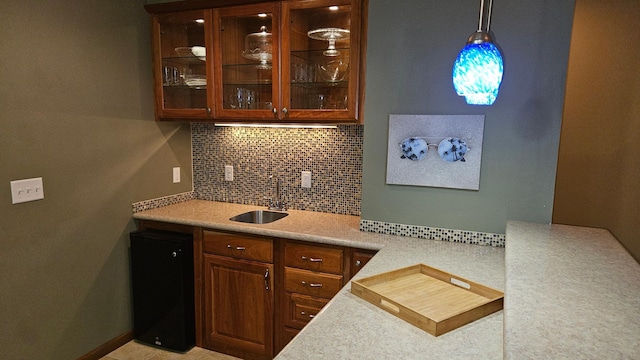 1125 Riverwood Dr SW, Oronoco, MN 55960 - bar with a sink, decorative backsplash, and hanging light fixtures