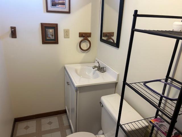 bathroom featuring toilet and vanity