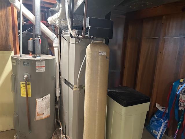 utility room with water heater