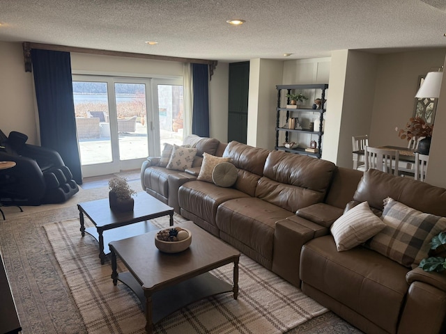 living area with a textured ceiling