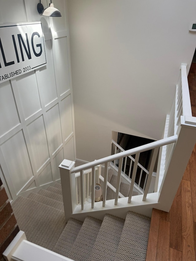 staircase with wood finished floors