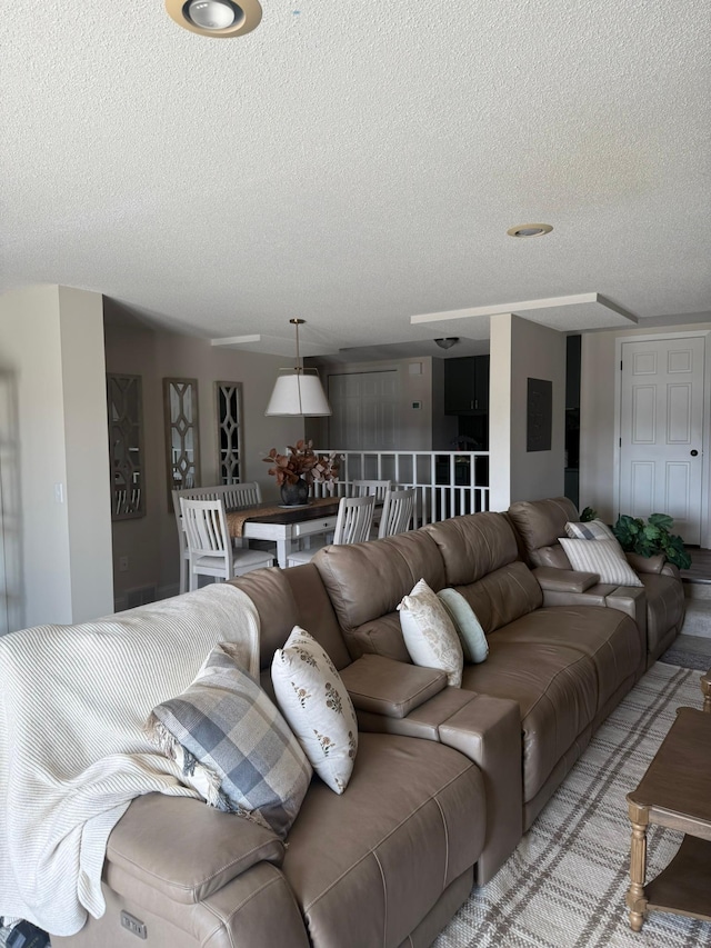 living room with a textured ceiling
