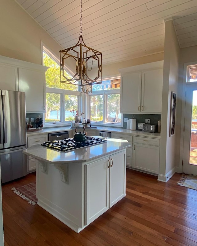kitchen featuring a chandelier, white cabinets, wooden ceiling, and stainless steel appliances