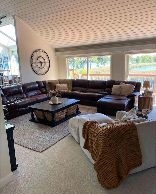 living area featuring wood ceiling, carpet, vaulted ceiling, and a wealth of natural light