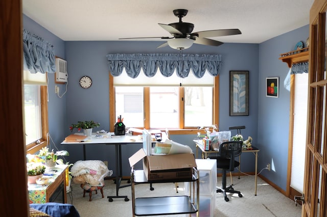 office area featuring carpet, a ceiling fan, baseboards, and heating unit