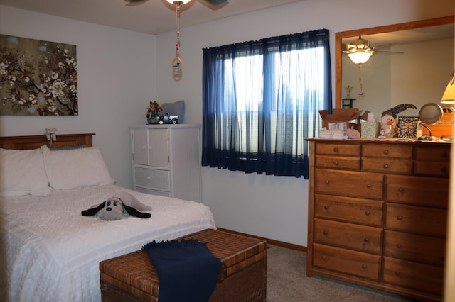 bedroom featuring carpet floors, baseboards, and ceiling fan