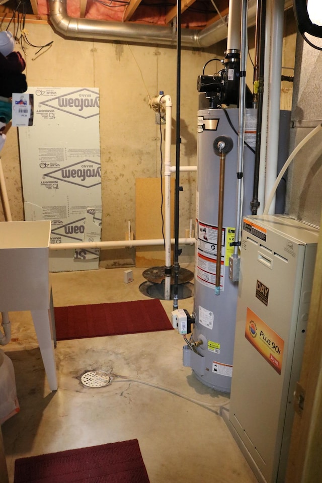 utility room featuring gas water heater