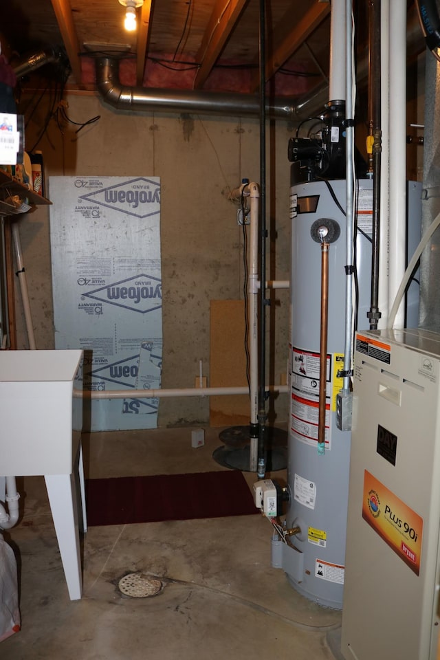 utility room featuring gas water heater