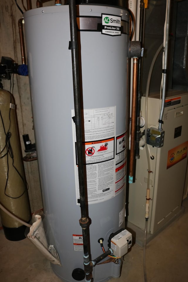 utility room featuring gas water heater