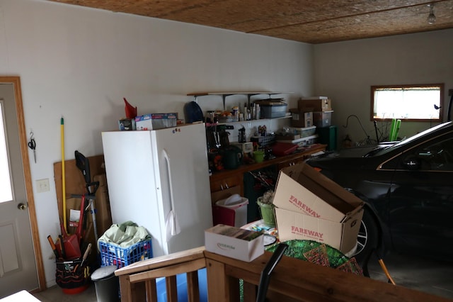 garage with freestanding refrigerator