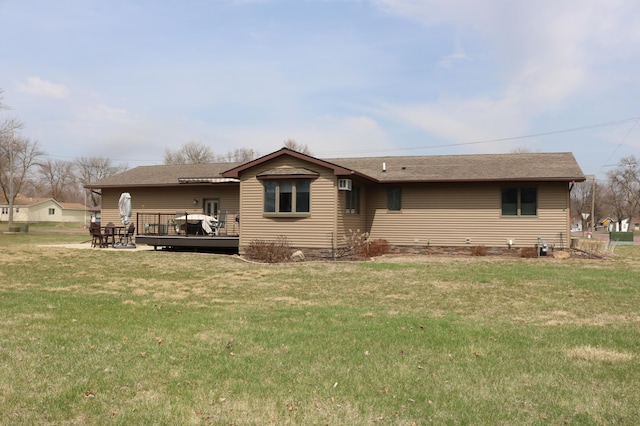 view of front facade featuring a deck and a front lawn
