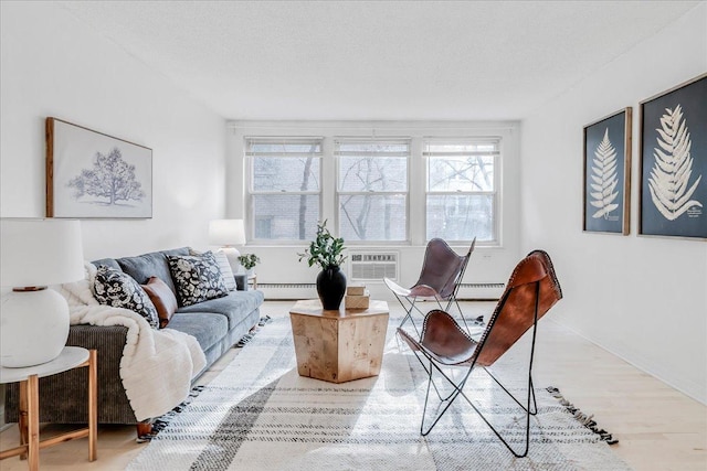 821 Douglas Ave Unit 105, Minneapolis, MN 55403 - living area with a baseboard heating unit, a baseboard radiator, plenty of natural light, and wood finished floors