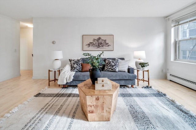 821 Douglas Ave Unit 105, Minneapolis, MN 55403 - living area with a baseboard heating unit and wood finished floors