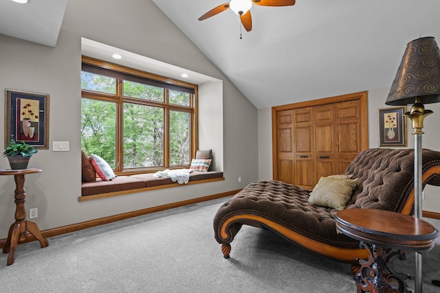 living area with ceiling fan, visible vents, vaulted ceiling, carpet flooring, and baseboards